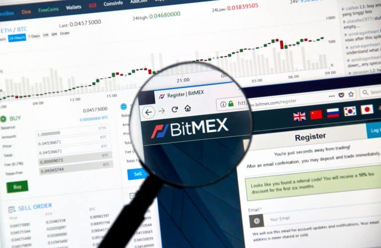 A computer screen displays a cryptocurrency trading platform with charts and graphs. A magnifying glass focuses on the BitMEX website registration page. The screen shows trading details and international flags.