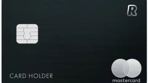 A sleek black credit card from Revolut Bank features a silver microchip on the left, with logos in the top and bottom right. The words "Card Holder" are elegantly placed near the bottom left, reflecting modern financial elegance.