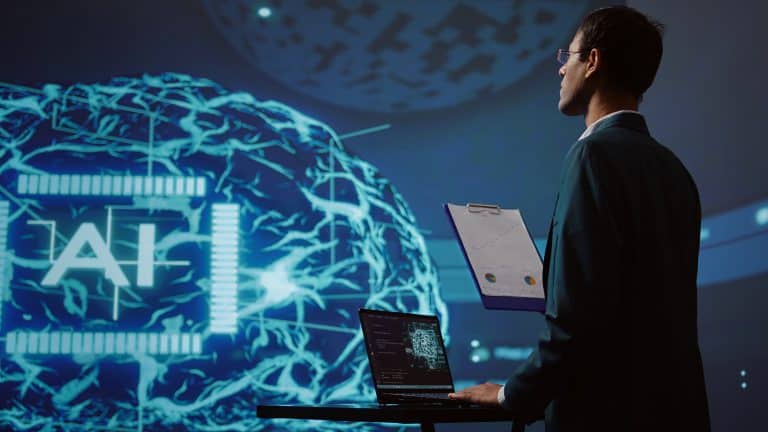 A man in a suit holds a clipboard and stands next to a laptop, observing a digital display with "AI" and neural network graphics—an ideal scene reflecting o mindset de investimento digital em um ambiente futurista e tecnológico.