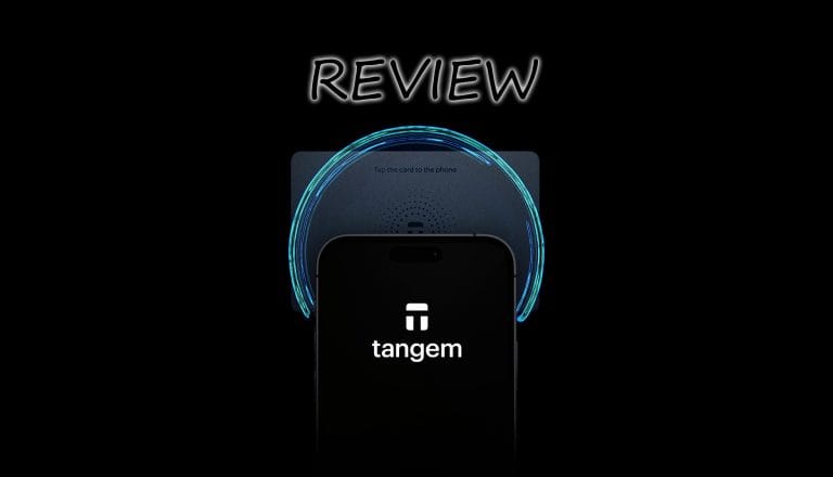 A smartphone with the word "tangem" on the screen is partially covering a card. Above them is the word "REVIEW." A glowing blue circle surrounds the card against a black background.